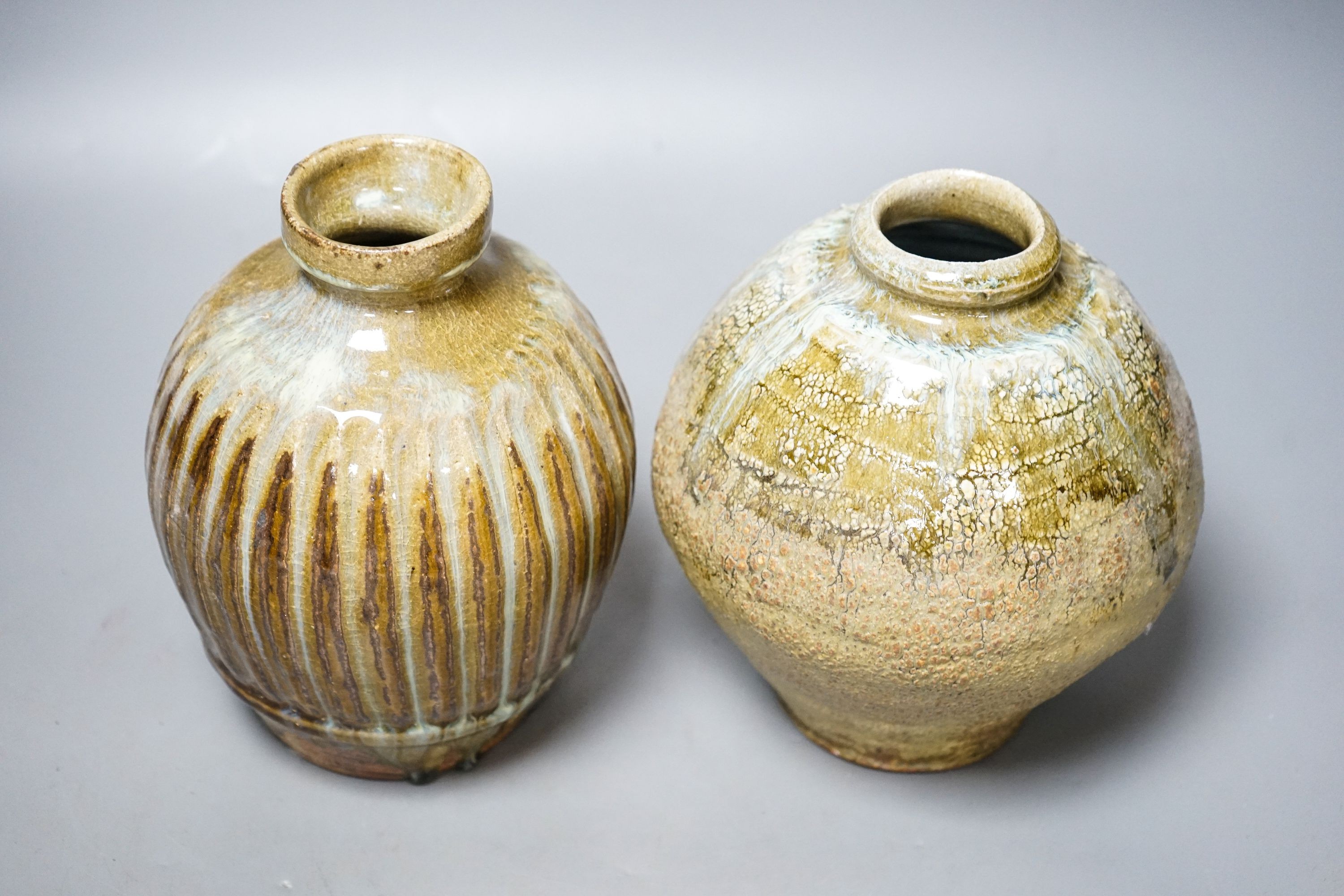 Mike Dodd (b.1943), a fluted globular stoneware vase and an ash glazed globular vase, tallest 18cm (2)